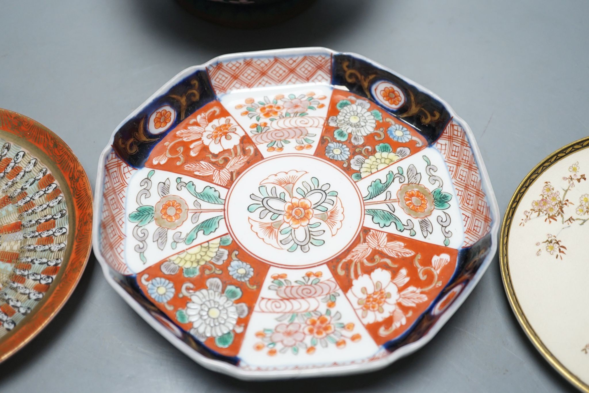 Two Japanese Satsuma pottery saucers, three Kutani saucers, and Imari dish and a Japanese cloisonné enamel koro and cover
